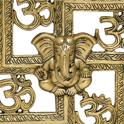 Wall hanging swastik with om and ganesh motiff in metal antique golden finish